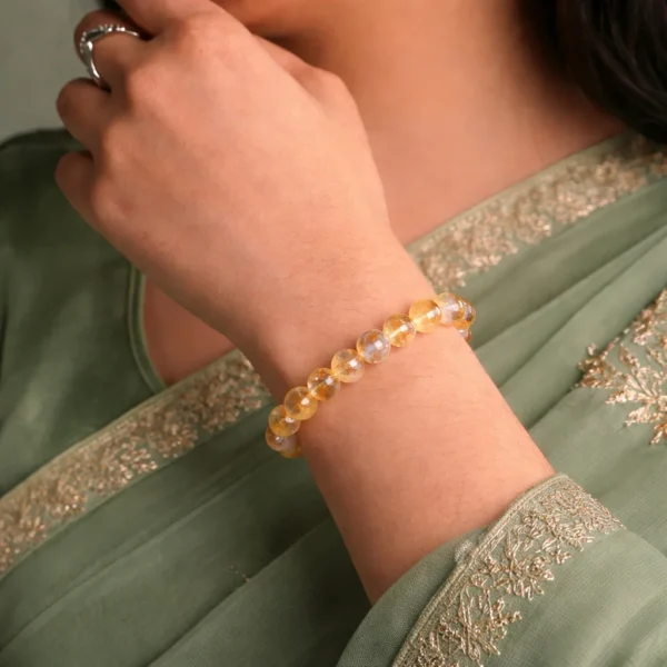 women wearing citrine bracelet