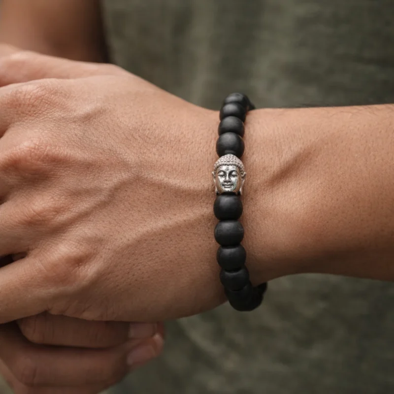 boy wearing karungali bracelet with buddha bead