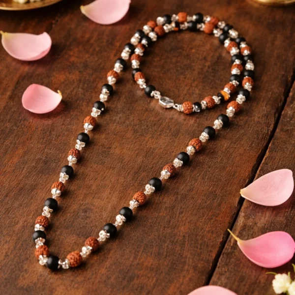 karungali and rudraksha mala in wooden table