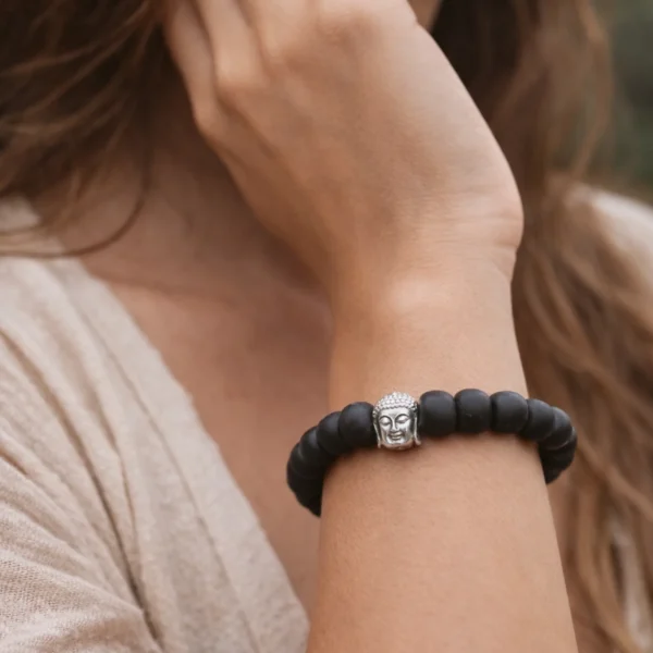 women wearing karungali bracelet with buddha bead